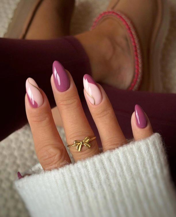 Uñas en tonos rosa y fucsia con lazo