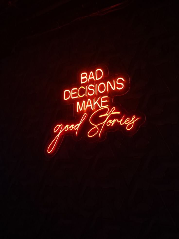 Letrero de neón rojo con una frase en inglés